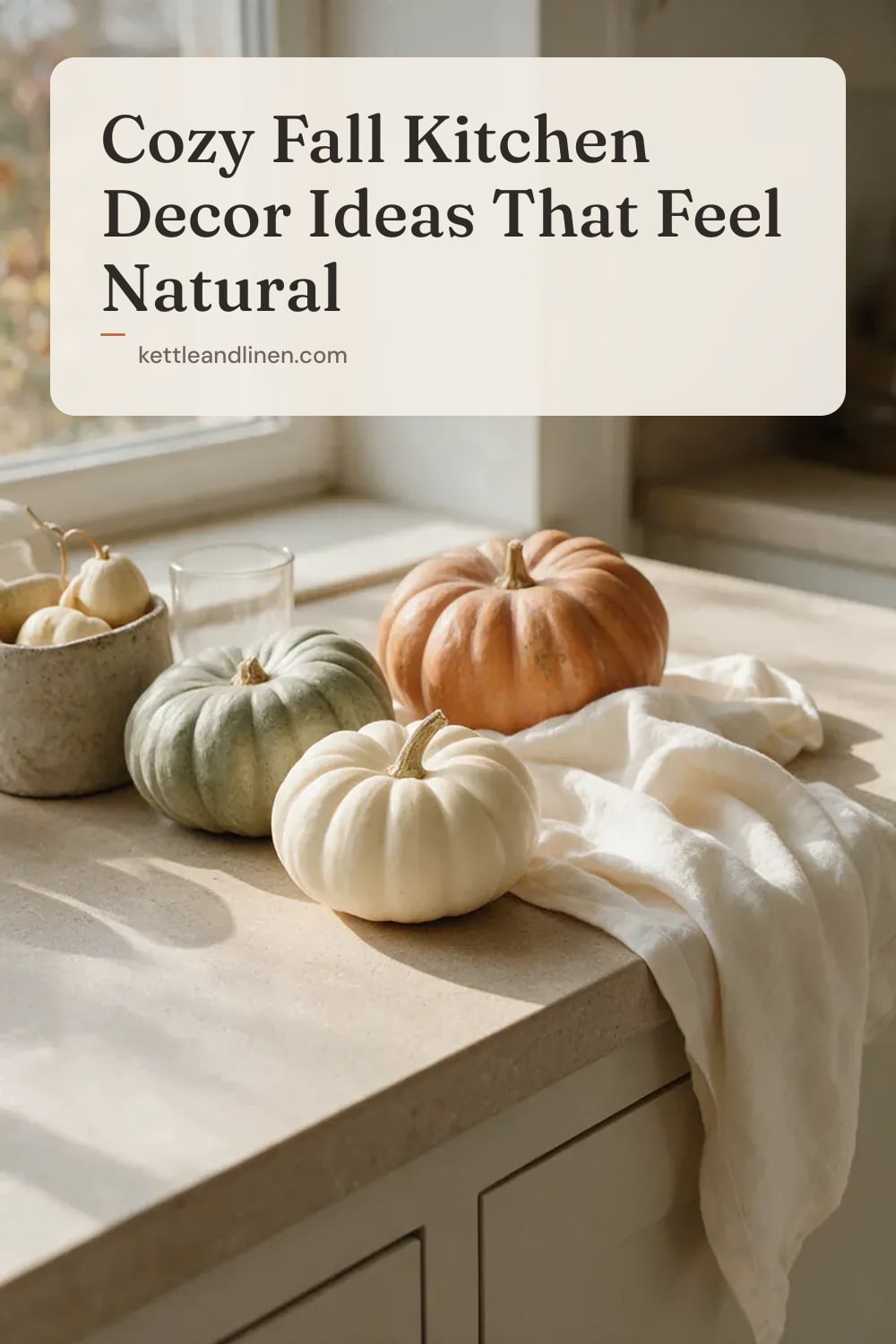 Small cream, green and orange pumpkins on a wooden kitchen counter by a window.