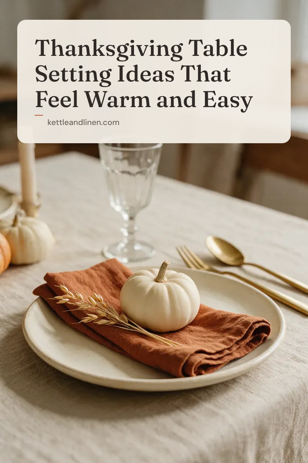 A Thanksgiving place setting with a rust linen napkin, a small white pumpkin and dried wheat.
