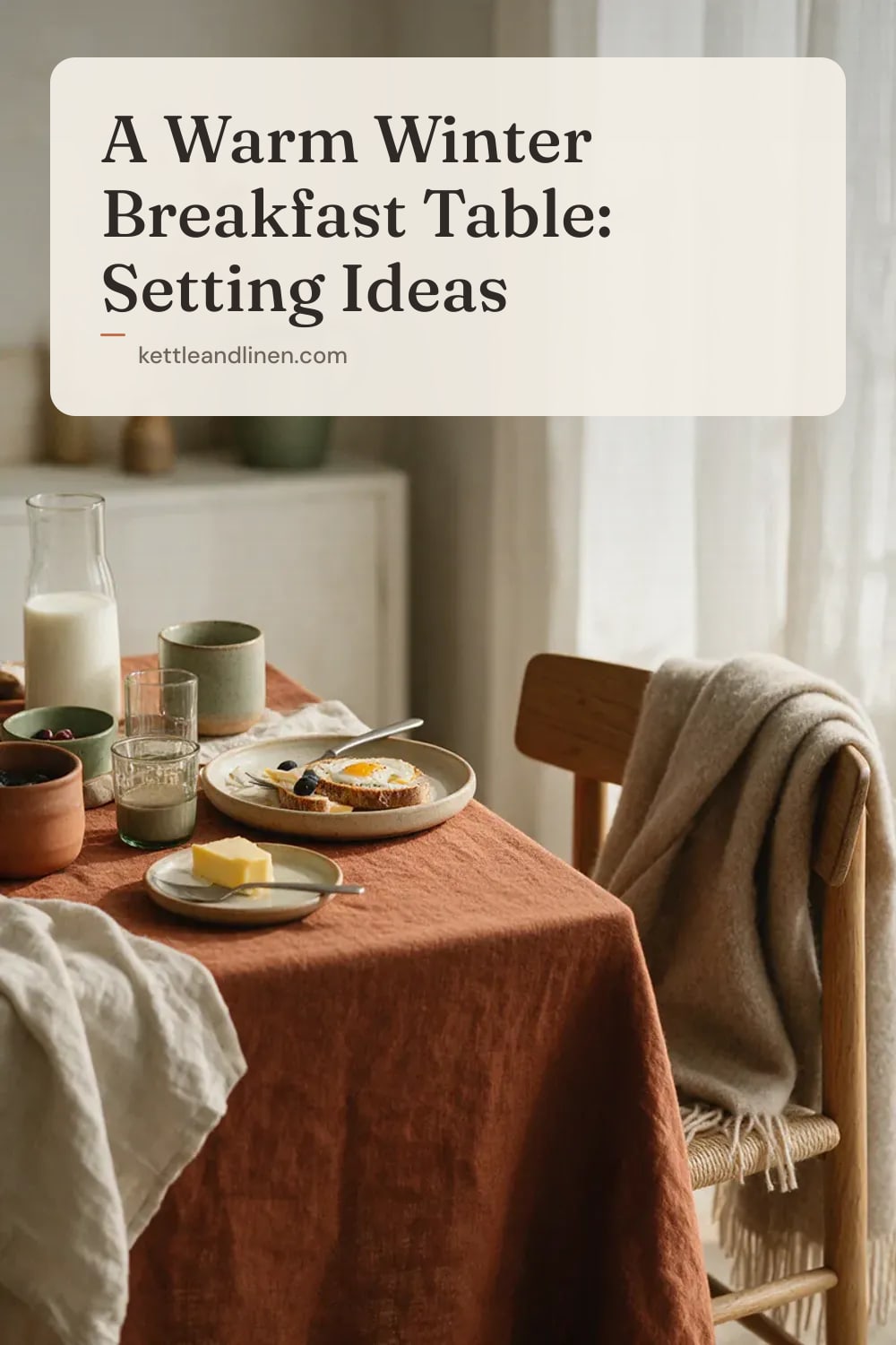 A rust linen tablecloth and a wool throw on a chair at a winter breakfast table.